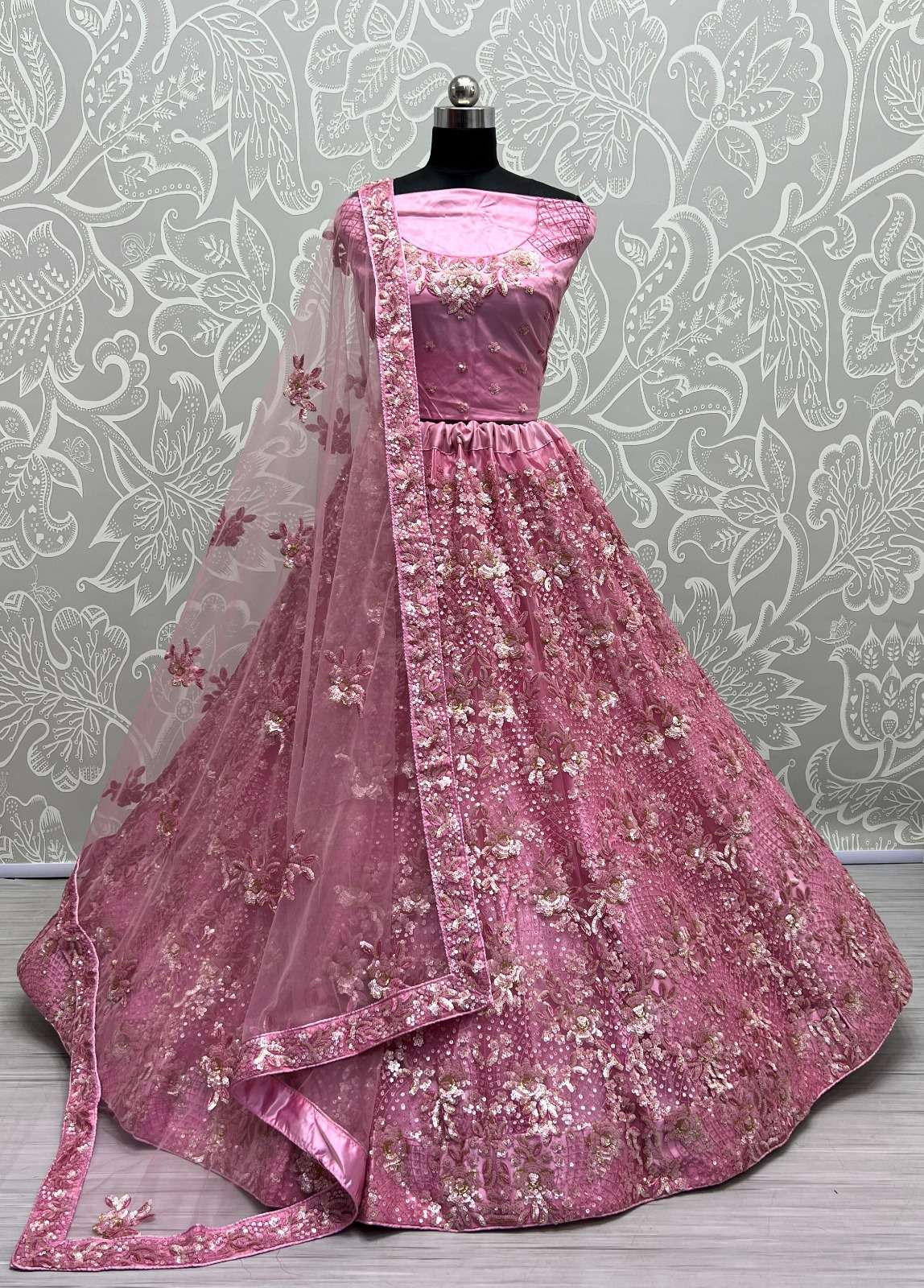 (SOLD) BEAUTIFUL PINK DESIGNER LEHENGA NETTING BASED HEAVY EMBROIDERY AND SEQUINCE WORK HEAVY FLARRED CAN CAN COMES WITH EMBROIDERY WORK BLOUSE AND NETTING DUPATTA