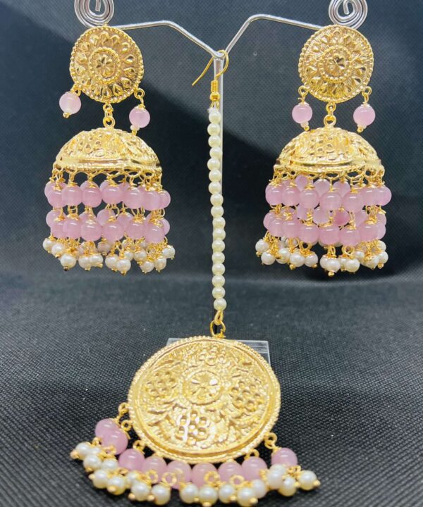 Gold plated jhumkas in baby pink pearls