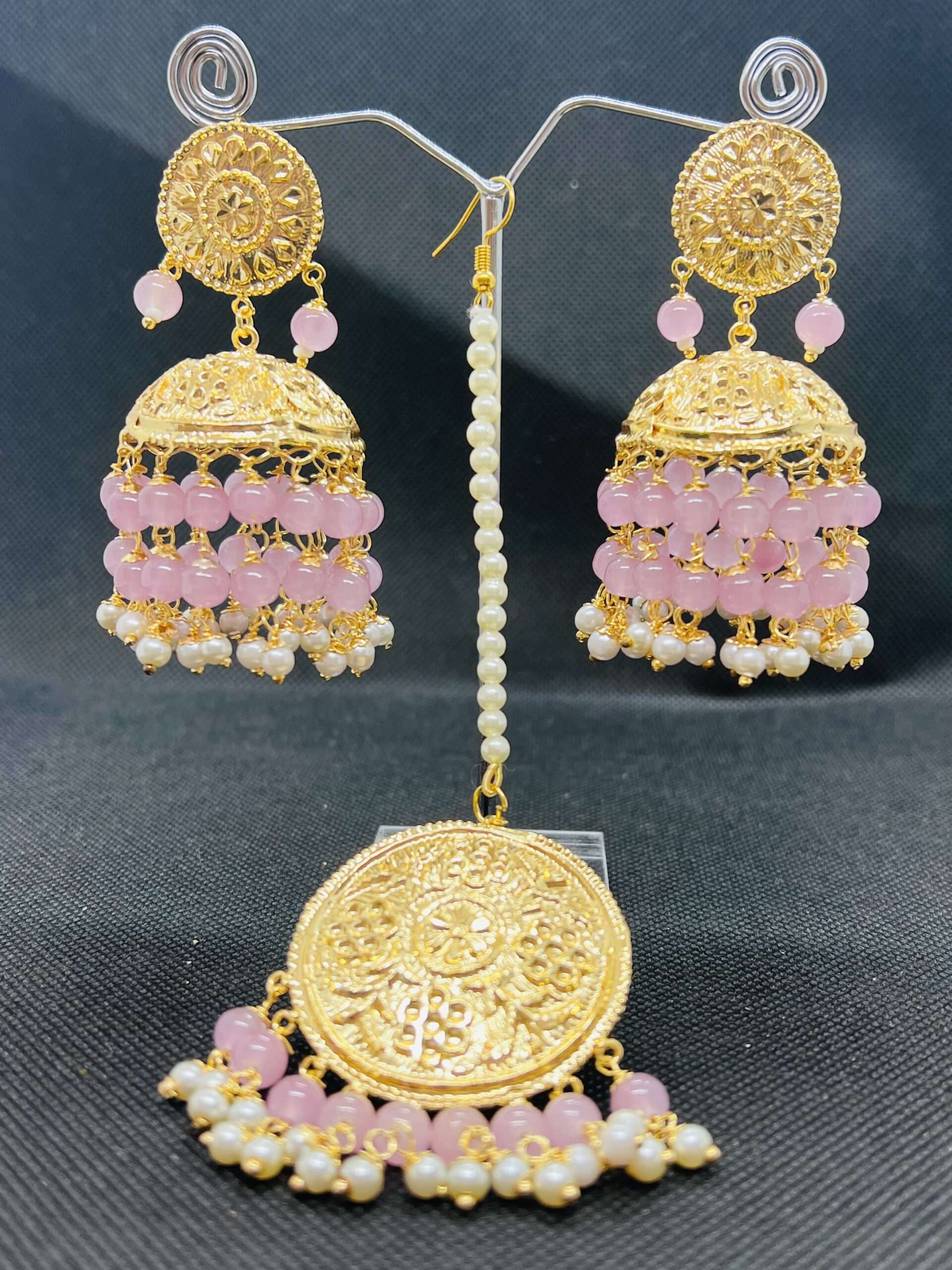 Gold plated jhumkas in baby pink pearls