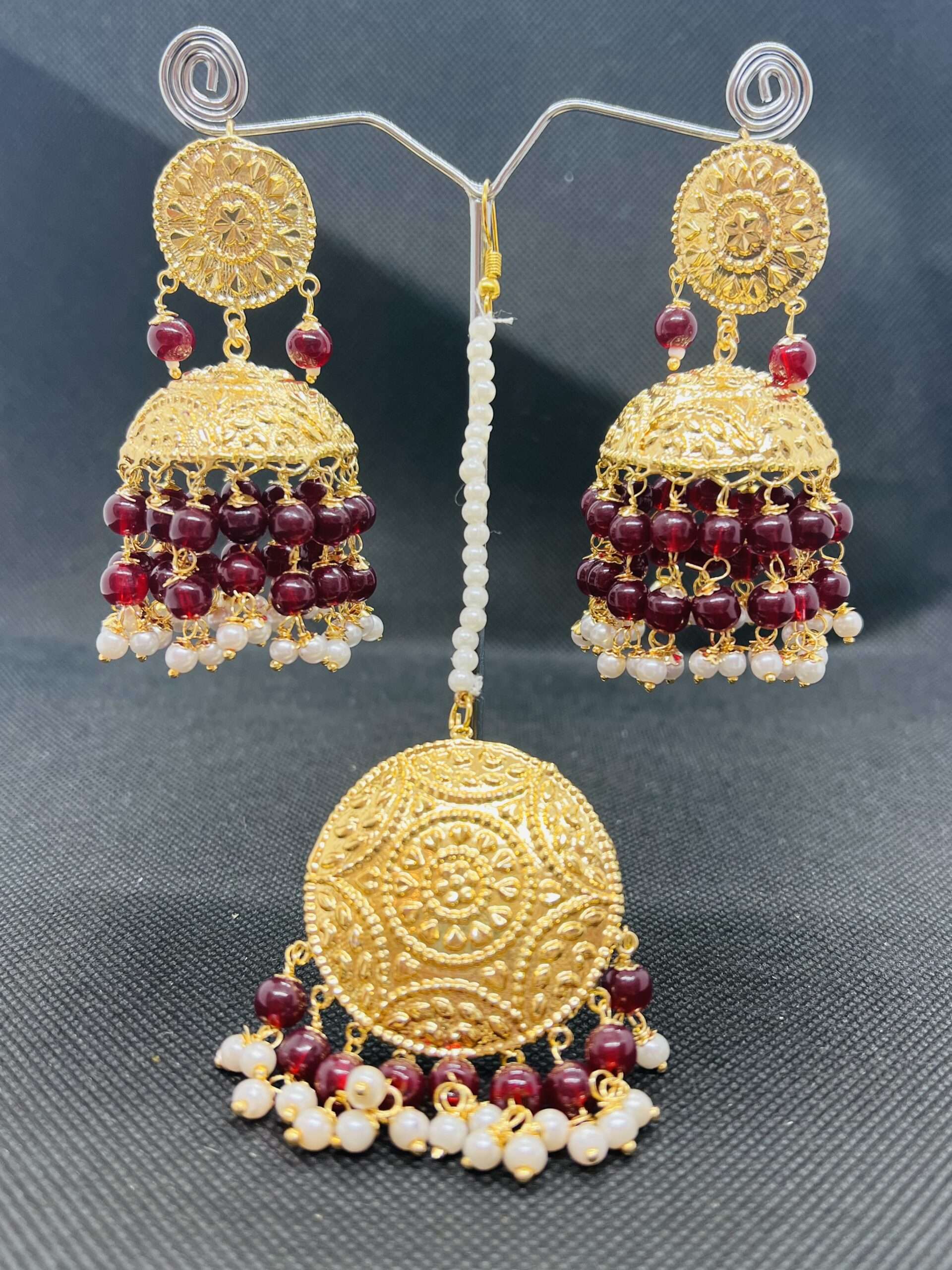Traditional  jhumki and tikka set gold plated.