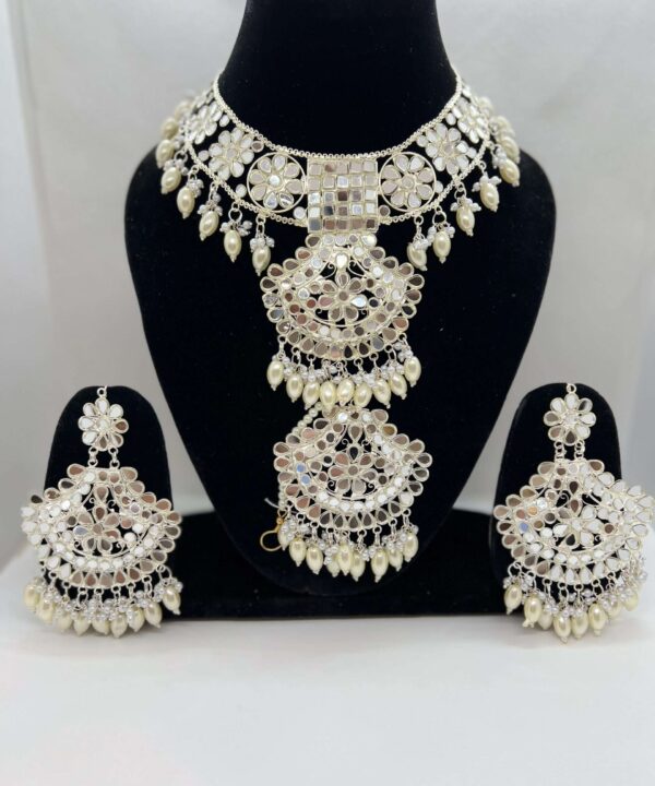 BEAUTIFULBEAUTIFUL OFF CREAM (NATURAL PEARL COLOR ) BEADED SILVER PLATED MIRROR WORK CHOKER SET WITH STATEMENT EARRING AND TIKKA