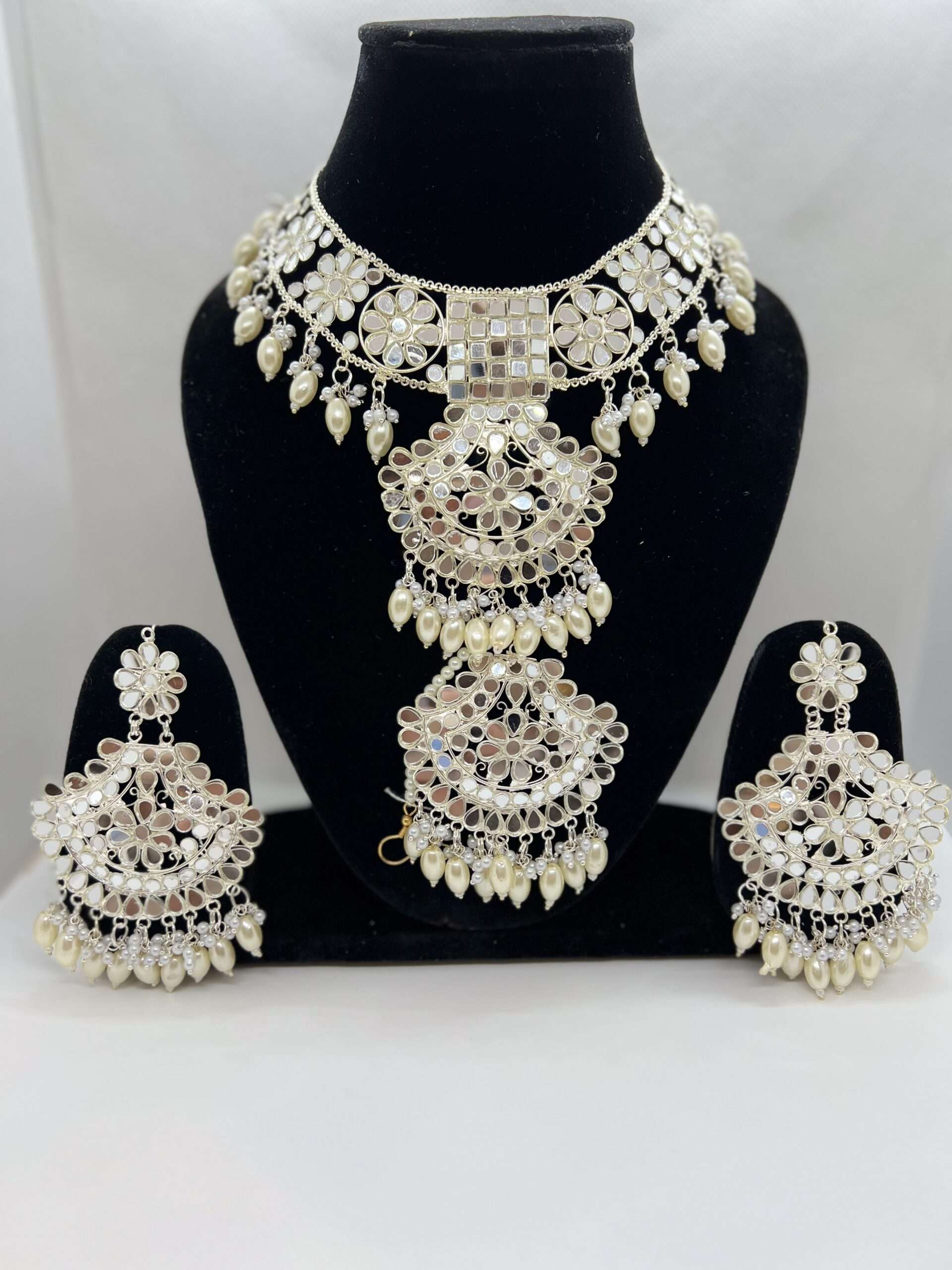 BEAUTIFULBEAUTIFUL OFF CREAM (NATURAL PEARL COLOR ) BEADED SILVER PLATED MIRROR WORK CHOKER SET WITH STATEMENT EARRING AND TIKKA