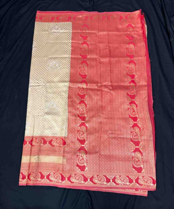 Banarasi Silk Saree With Zari Work Off White With Red Border Comes With Contrast Blouse.