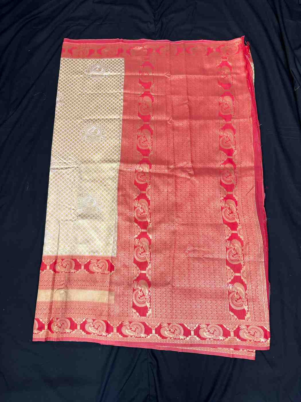 Banarasi Silk Saree With Zari Work Off White With Red Border Comes With Contrast Blouse.