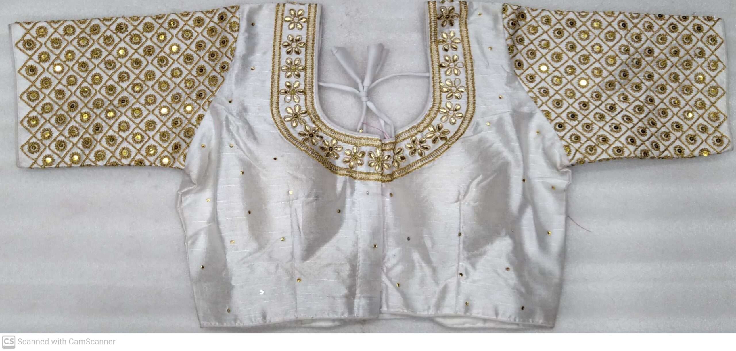 (Sold) WHITE COLOR DESIGNER BLOUSE WITH FRONT AND BACK EMBROIDERY AND STONE WORK.