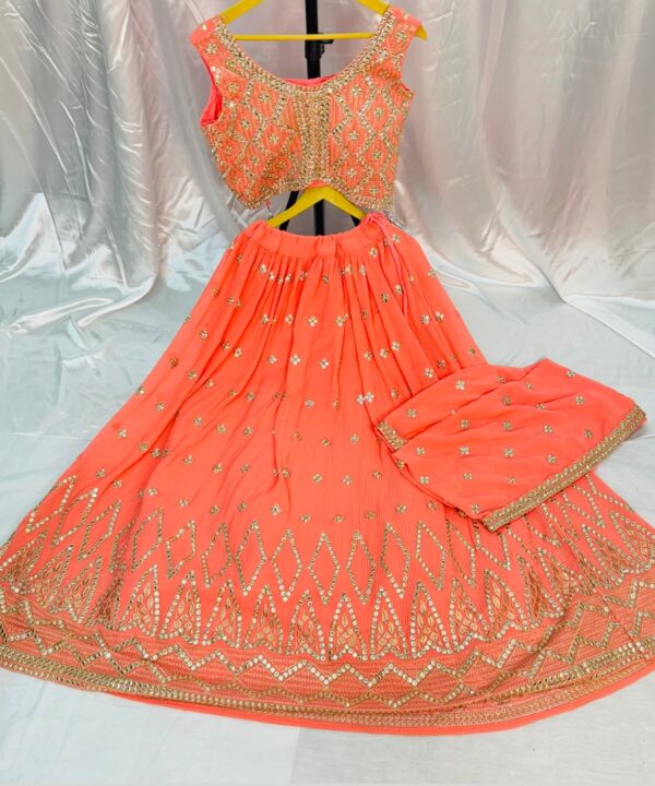 PEACH COLOR GEORGETTE FABRIC BEAUTIFUL CROP TOP EMBROIDERY AND STONE WORK COMES MATCHING DUPATTA EMBROIDERY AND FOUR SIDE LACE WORK.