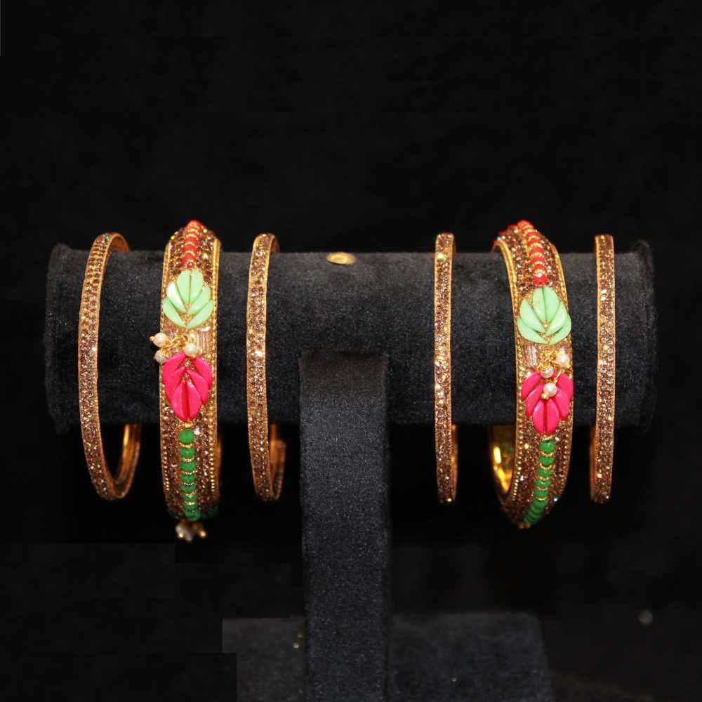 Beautiful green and pink color leaf design with fine crystal and pearl work metal bangles